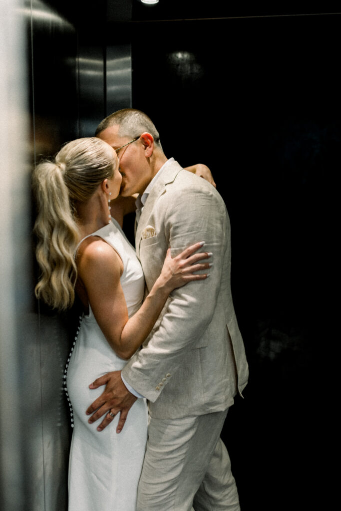 Lindsay & Isidro kissing in elevator