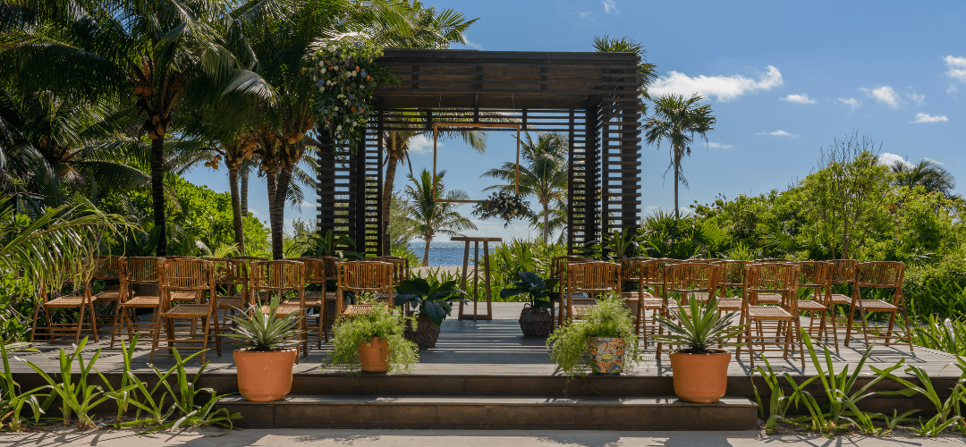Gazebo at UNICO 20°87° Hotel Riviera Maya featuring a small wedding ceremony set up under a gazebo