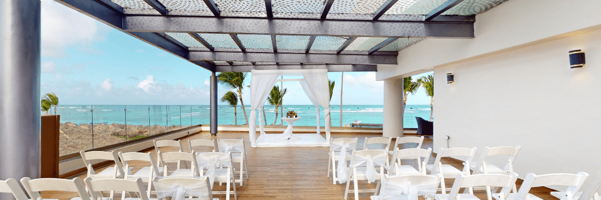 Rooftop Destination Wedding Venue at Royalton Barvara with glass sides overlooking the blue ocean